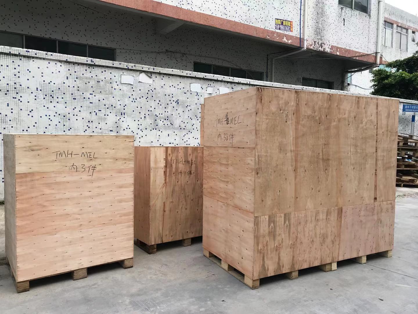 Furniture is packed in wooden crates for shipment to Australia.